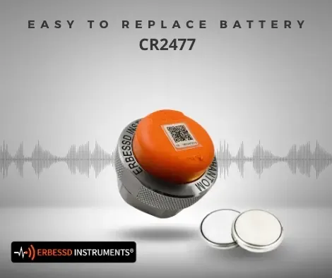 PHANTOM® sensor next to two CR2477 coin cells, its easy-to-replace battery