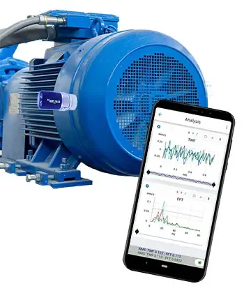 A phone running WiSER VIBE® showing a waveform and its spectrum, in front of a blue industrial motor with a PHANTOM® sensor